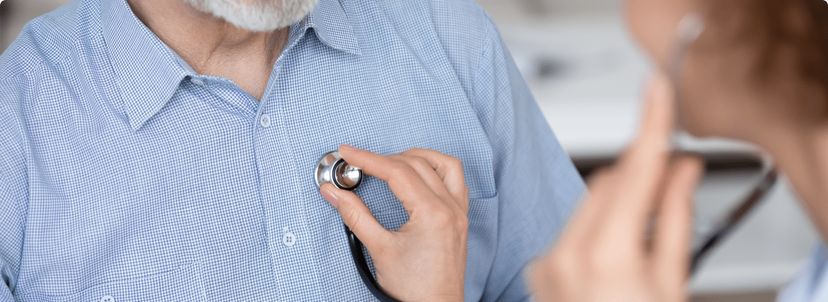 Doctor listening to a patient’s chest using a stethoscope